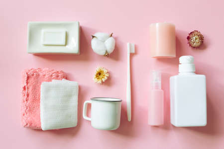 Various spa shower bath accessory bodycare products on pink background. flat lay, top viewの写真素材