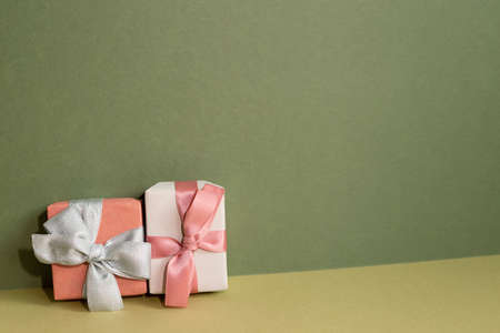 Pink gift box on table. khaki green backgroundの写真素材