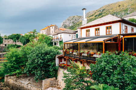 Old town Neretva riverside restaurant in Mostar, Bosnia and Herzegovinaのeditorial素材
