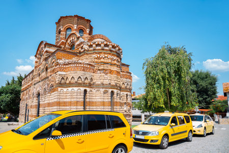 Church of Christ Pantocrator with yellow taxi car in Nessebar, Bulgariaのeditorial素材