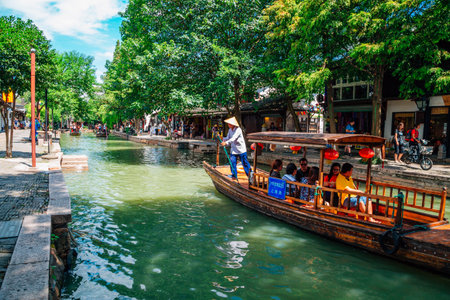 Shanghai, China - August 8, 2016 : Chinese traditional wooden boats on canal of Shanghai Zhujiajiao water townのeditorial素材