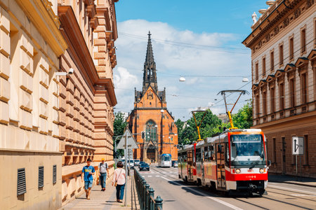 Brno, Czech Republic - June 21, 2019: Old town street, The Church of Jan Amos Comenius Red Church and tramのeditorial素材