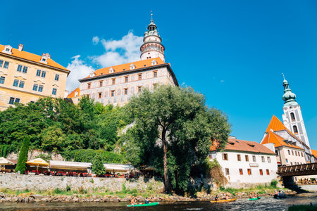Cesky Krumlov, Czech - August 28, 2016 : Castle Tower and Summer leisure kayaking at Vltava riverのeditorial素材