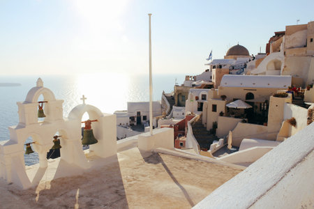 Oia town on Santorini island, Greece. Traditional houses and sea in sunset timeのeditorial素材