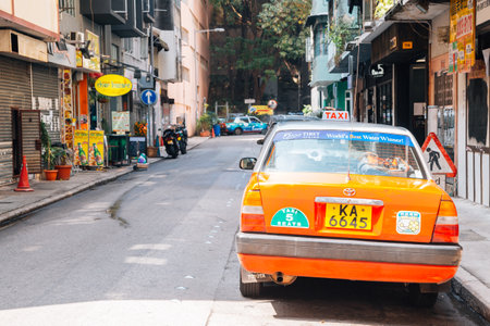 Hong Kong - March 20, 2017 : Tai Hang street and red taxiのeditorial素材