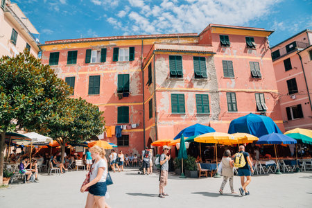 Cinque Terre, Italy - August 16, 2016: Seaside village Vernazza, beach restaurant and tourist peopleのeditorial素材