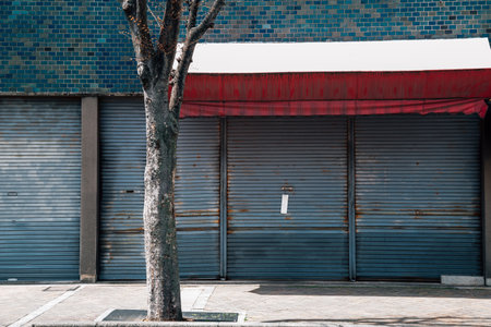 Closed metal shutter door of building. Japanese street viewのeditorial素材