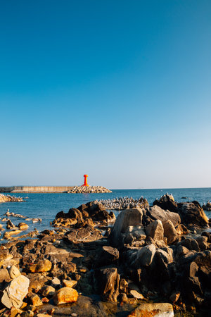 Namae-hang sea and red lighthouse in Yangyang, Koreaのeditorial素材