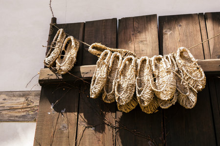 Straw shoes hanging on a line in Korea