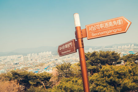 Hwaseong Fortress Hwaseomun and Seonamgangnu sign with Suwon city view in Korea