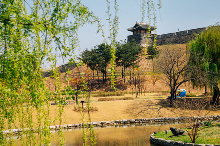Hwaseong Fortress with pond at spring in Suwon, Korea