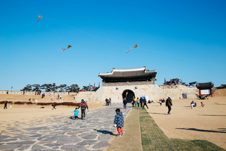 Suwon, Korea - February 10, 2016 : Fly a kite in Hwaseong Fortress Changnyongmun Gate