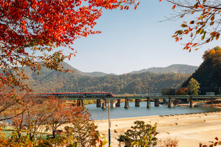 Railroad with Miryang river and mountain at autumn in Miryang, Koreaのeditorial素材
