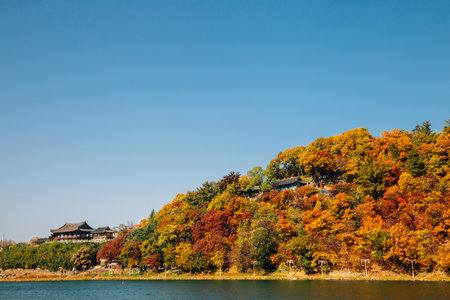 Yeongnamnu Korean traditional pavilion and autumn colorful mountain in Miryang, Koreaのeditorial素材