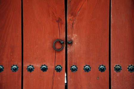 Korean traditional red wooden door at Jongmyo Shrine in Seoul, Koreaのeditorial素材