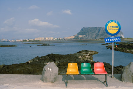 Jeju Island, Korea - March 1, 2022 : Seongsan Ilchulbong Tuff Cone and sea, Jeju Olle Trail route 2のeditorial素材