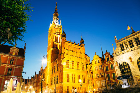 Town Hall and Neptune's Fountain at Dlugi Targ (Long Market) street at night in Gdansk, Poland