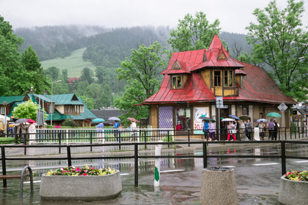 Zakopane, Poland - June 17, 2019: Zakopane city center street at rainy dayのeditorial素材