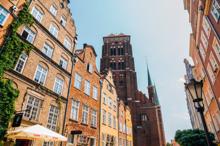 Gdansk, Poland - June 12, 2019: Piwna Street old buildings and St. Mary's Cathedralのeditorial素材