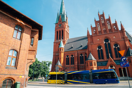 Torun, Poland - June 11, 2019: Old church and modern tram at old townのeditorial素材