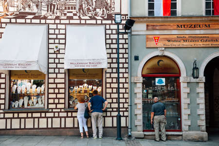 Gdansk, Poland - June 12, 2019: Old town street, amber jewelry accessory shopのeditorial素材