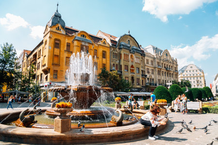 Timisoara, Romania - July 20, 2019: Fish Fountain and Victory square Piata victorieiのeditorial素材