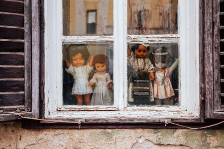 Sibiu, Romania - July 22, 2019 : Dolls in a window