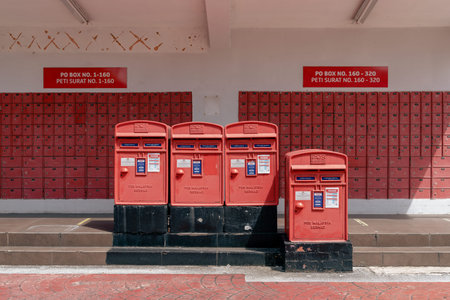 Johor Bahru, Malaysia - October 25, 2022 : Post Office red mailboxのeditorial素材