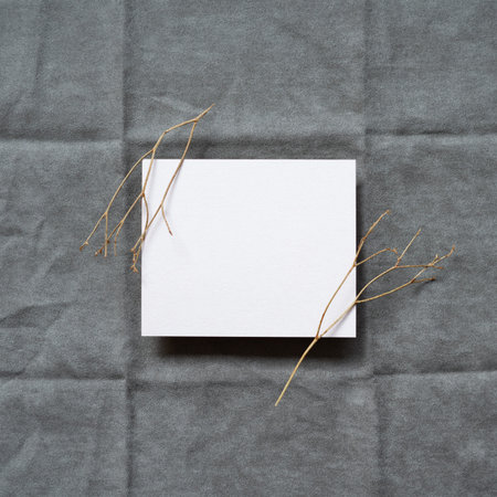 Blank memo pad on gray fabric background. top view, copy space