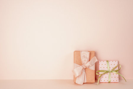 Pink gift boxes on pink table. pink wall background. copy spaceの写真素材