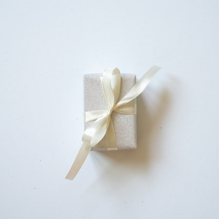 Silver glitter gift box isolated on white background. top view, copy spaceの写真素材