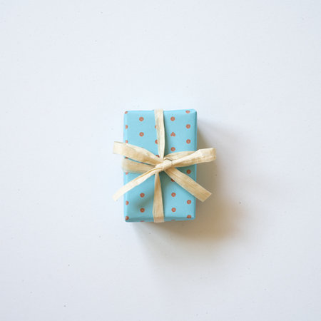 Sky blue dot pattern gift box isolated on white background. top view, copy spaceの写真素材