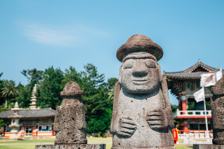 Yakcheonsa Temple and Dol hareubang in Jeju Island, Koreaのeditorial素材