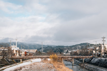 View of Takayama village and miyagawa river with winter snow in Gifu, Japanのeditorial素材