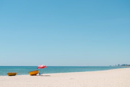 Da Nang, Vietnam - June 22, 2023: My Khe Beach and red parasolのeditorial素材