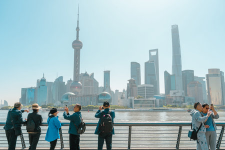 Shanghai, China - April 18, 2024: The Bund Waitan street, Oriental Pearl Tower and city view