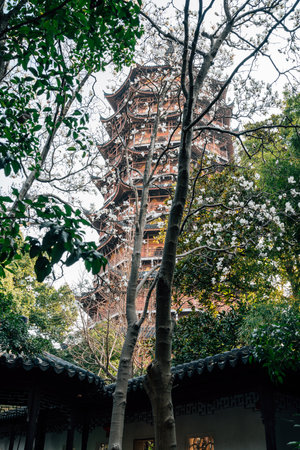 Suzhou, China - March 16, 2025: Exterior view of North Temple Beisi Pagoda with flowersのeditorial素材