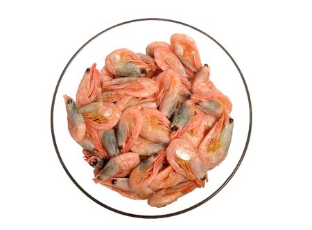 The bowl with fresh shrimps isolated on whiteの写真素材