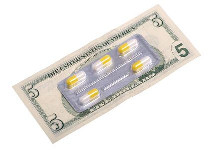 Abstract photo of pills on dollar banknoteの写真素材