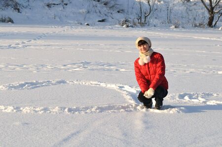 Young woman posing in winter and smilingの写真素材