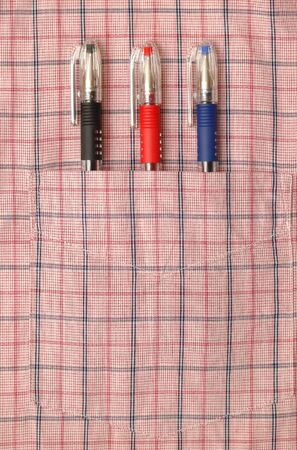 Three pens in the pocket of shirtの写真素材