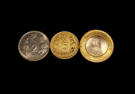 indian currency, india's rupee in black background, indian coin
