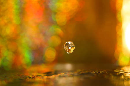 drop  Gold backgroundの写真素材