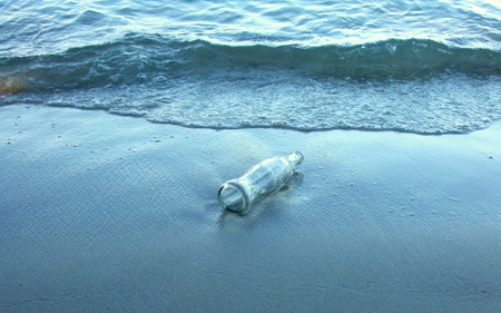 wave and beach and bottleの写真素材