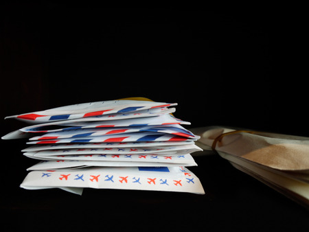 Letters and documents stack in wooden bookshelf.の写真素材