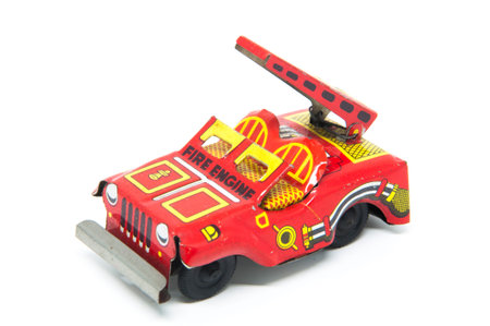 Tin toy fire engine isolated on white background