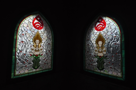 Stained glass windows of angel at the temple in Northern Thailand の写真素材