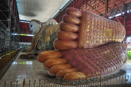 The giant reclining Buddha footprint detail shows refinement of the work at Chaukhtatgyi temple in Yangon, Myanmar.のeditorial素材