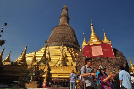 Yangon,Myanmar - 28 November 2015: Unknown tourists visit Shwe Maw Daw Pagoda in Yangon,Myanmar.のeditorial素材