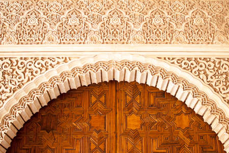 geometric and decorative figures on the walls of the buildings of the Alhambra in Granada, Andalusia, Spainの写真素材